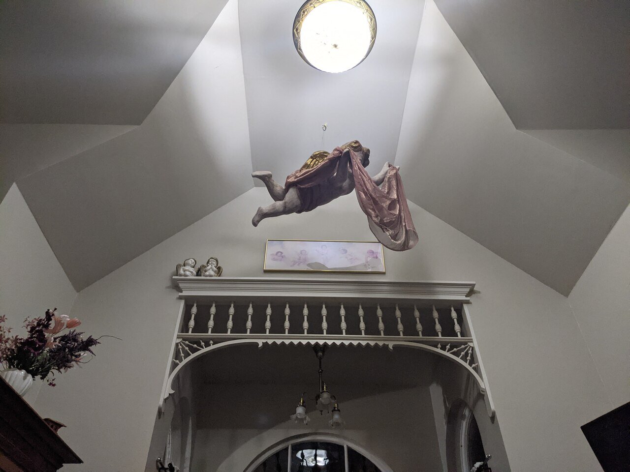 hanging cherub decoration in a small hotel, California