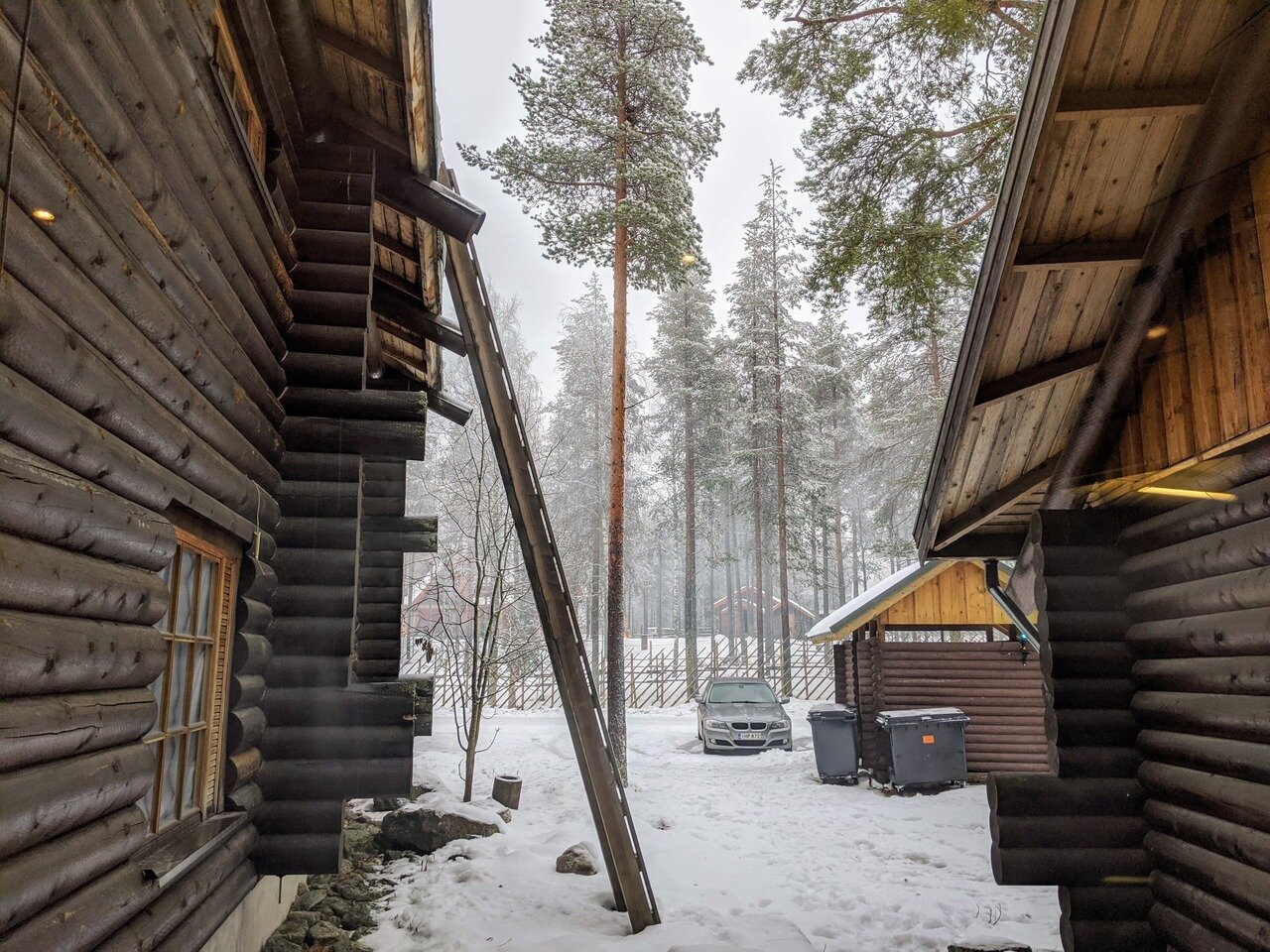 view between log houses, Santa Claus Village, Rovaniemi, Finland