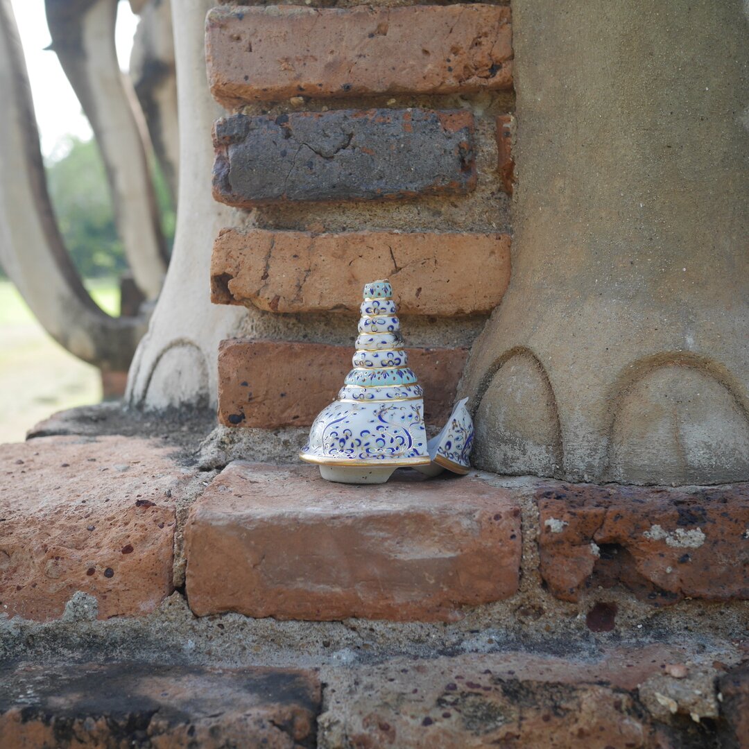 broken offering, Sukhothai, Thailand