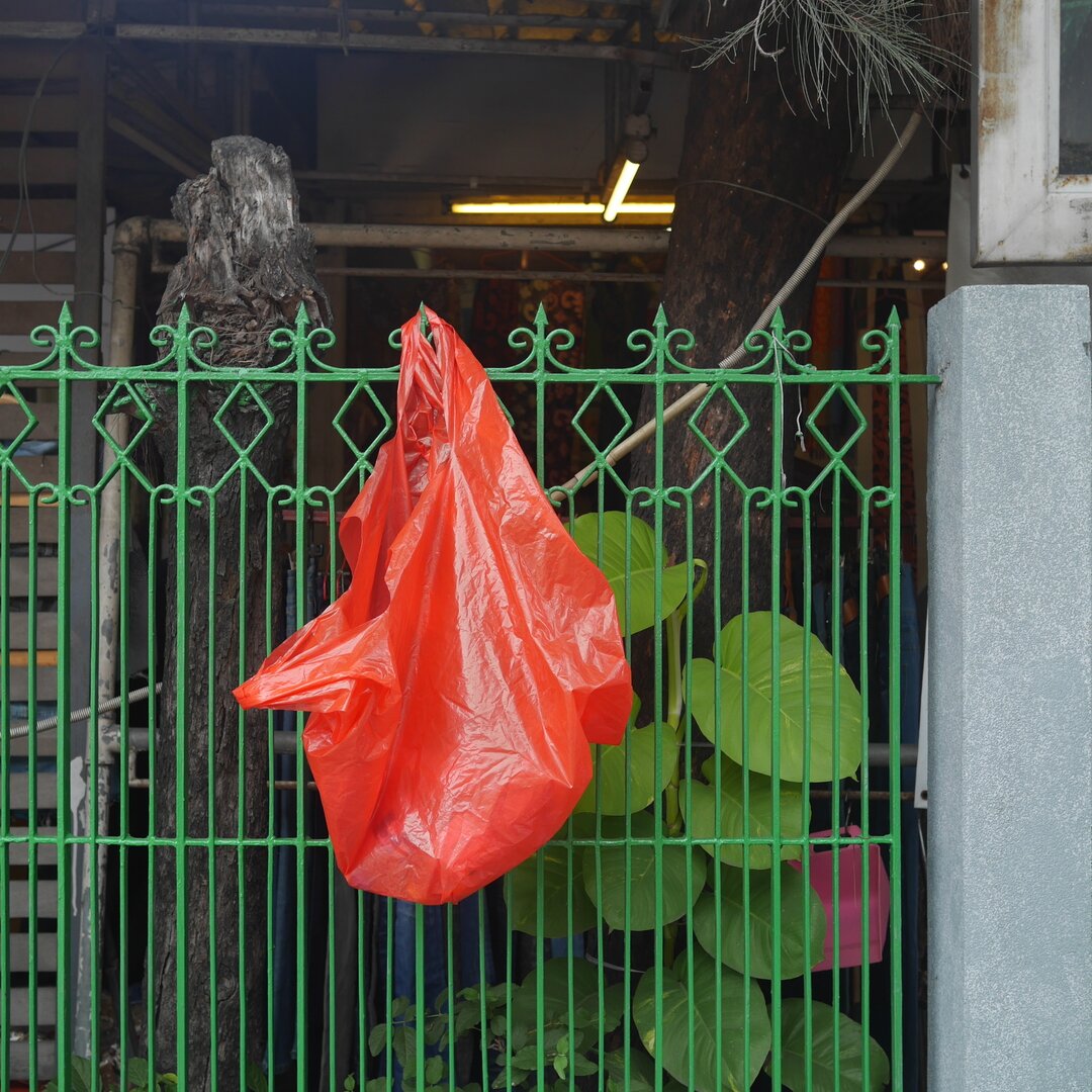 red plastic bag, Chatuchak, Bangkok, Thailand