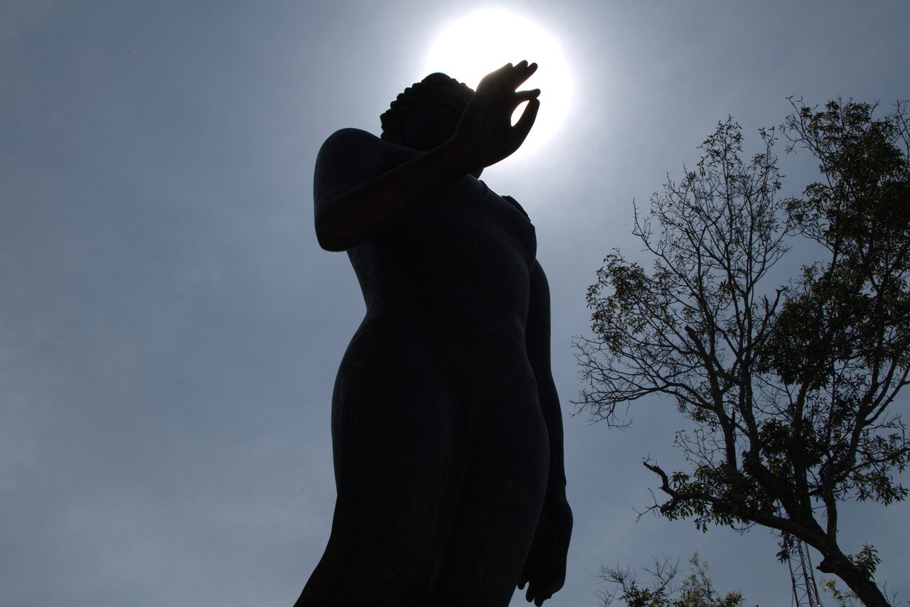 Buddha and the sun, Wat Phra That Pu Khao, Thailand