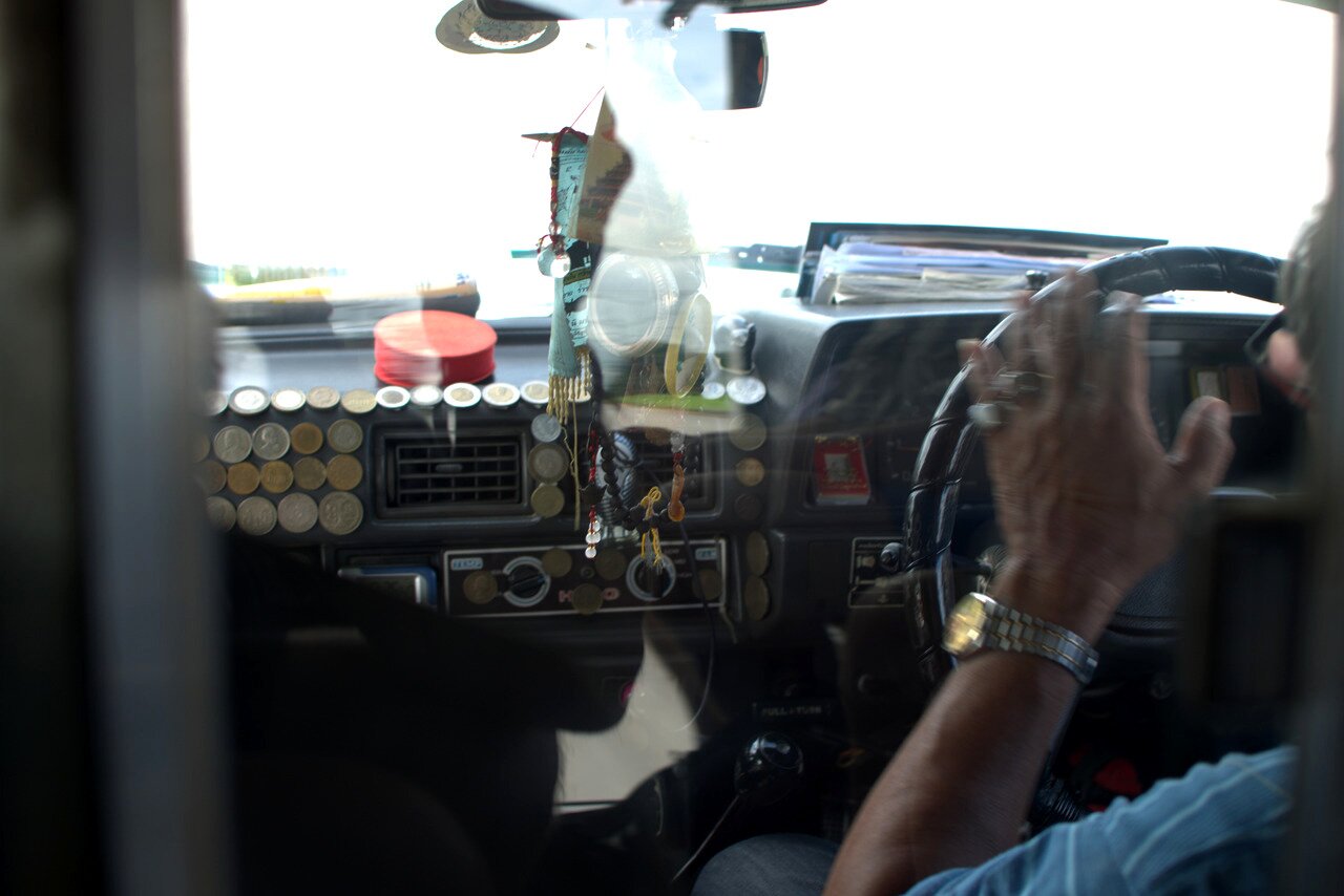 songthaew driver and dashboard, northern Thailand